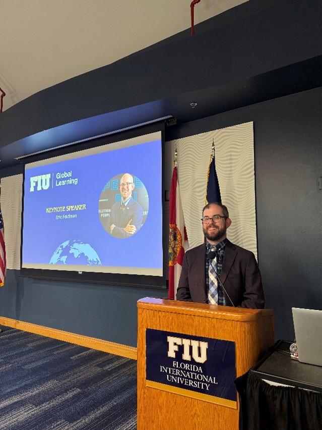 Eric Feldman providing keynote speech at the Spring 2025 Global Learning Ceremony.